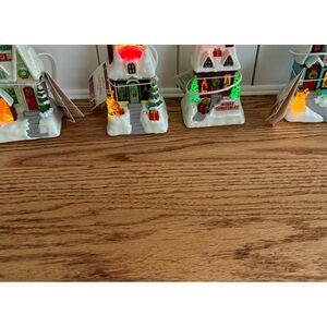 Caroling cottages. Music,lights,interactive. Hallmark.